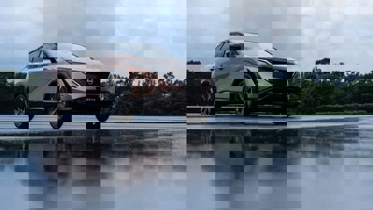 Nissan Aryia in wet parking lot